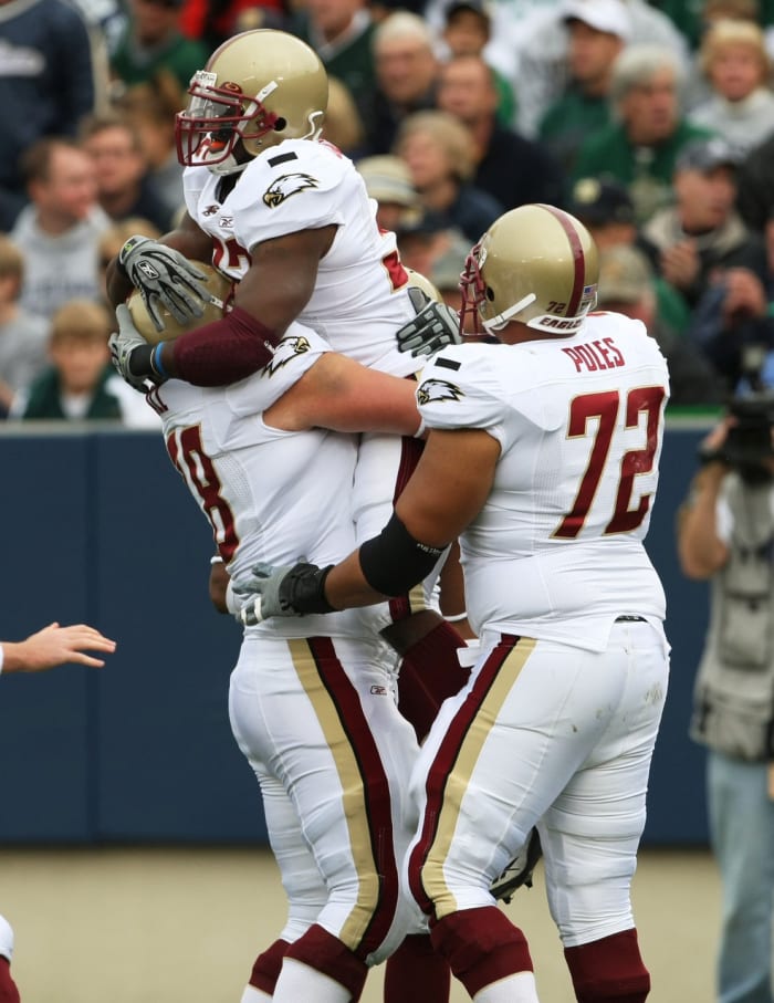 Oct. 13, 2007; South Bend, IN, USA; Boston College Eagles running back Andre Callender (32) celebrates his first quarter touchdown against the Notre Dame Fighting Irish with guard Ty Hall (78) and tackle Ryan Poles (72) in the first quarter at Notre Dame Stadium. Mandatory Credit: Matt Cashore-USA TODAY Sports